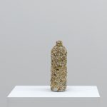 Cristaline, 2017, Cristaline bottle, pebbles, glue, 31 x 10 x 10 cm